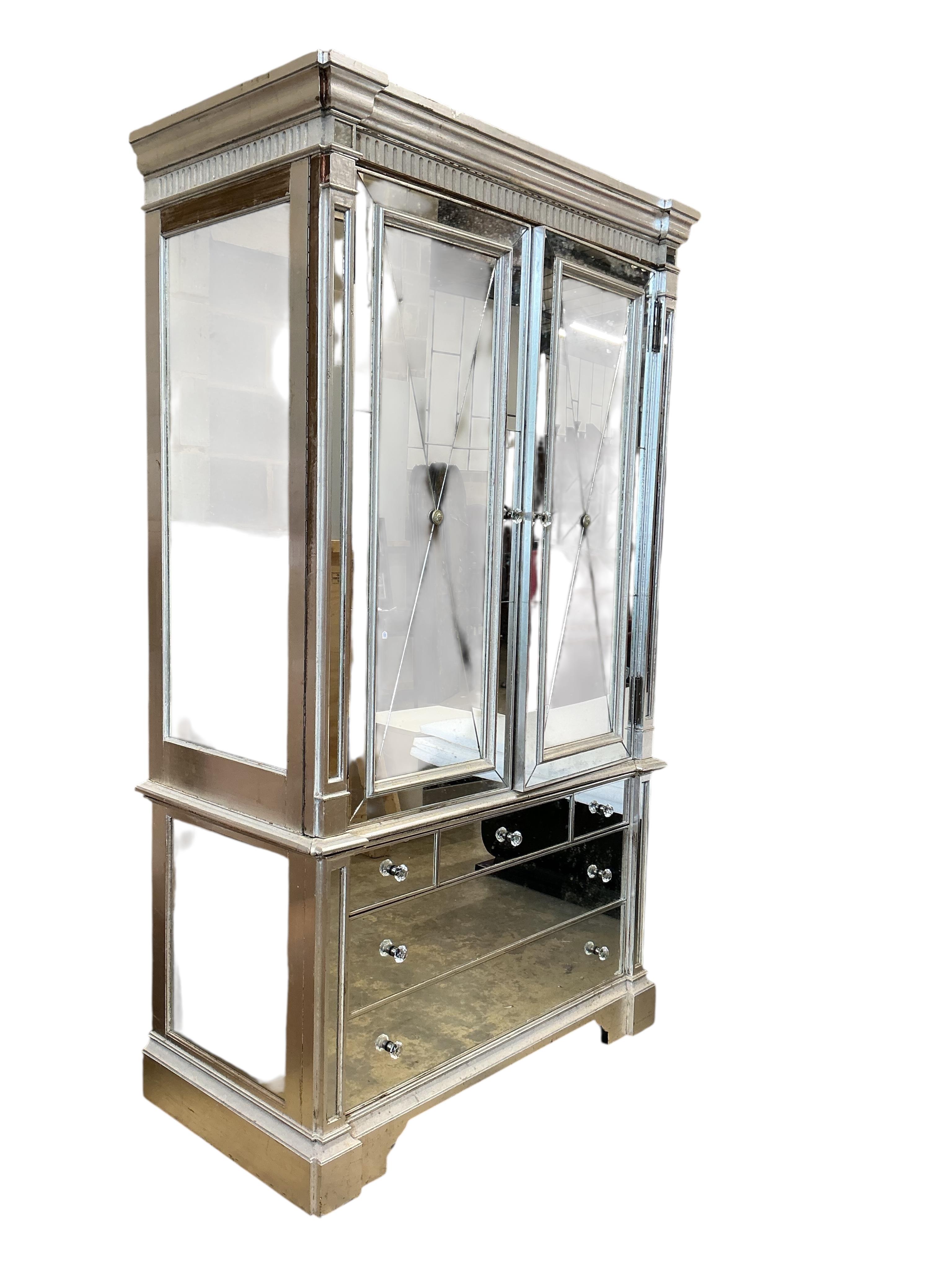 A contemporary mirrored media cabinet, width 144cm, depth 67cm, height 22cm